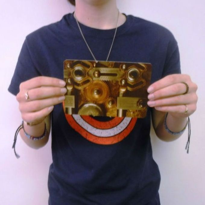 Visual Explorer sample card being held in both hands