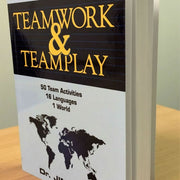 Book titled 'Teamwork & Teamplay' with a world map on the cover